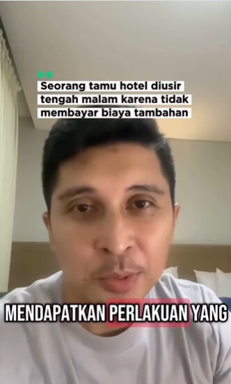 Kamar hotel yang bersih dan rapi dengan tempat tidur rapi dan pencahayaan hangat
